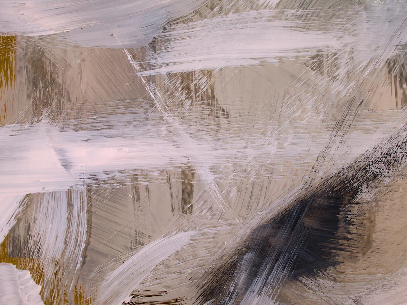 A close-up of a painted surface showing thick white, taupe and charcoal brushstrokes with visible ridges of paint.